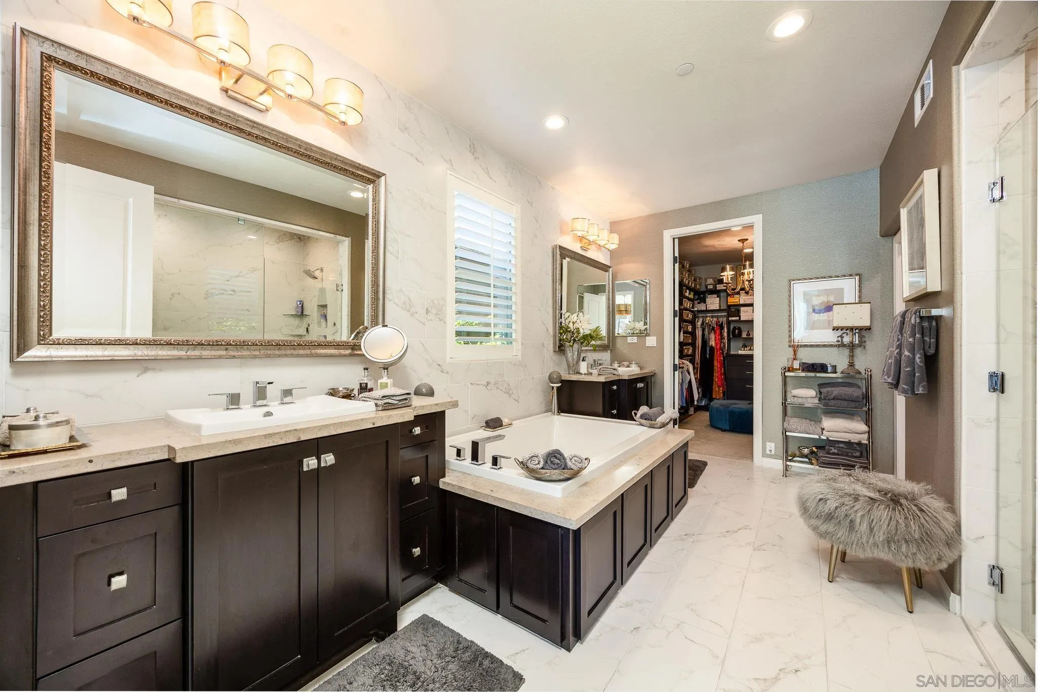 8112 Auberge Circle San Diego, CA 92127 - Photo 12 of 45 a bathroom with a tub sink and mirror