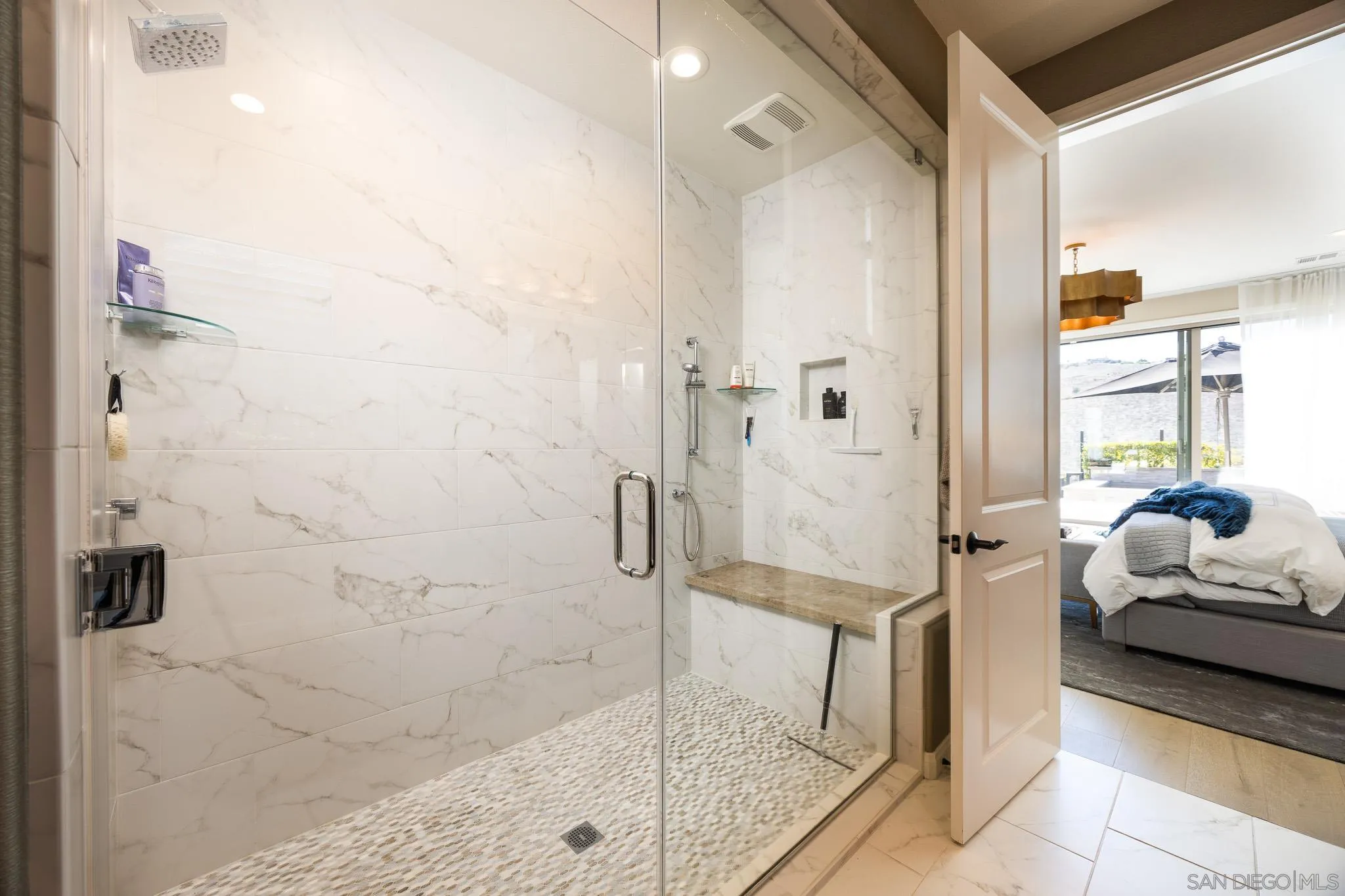 8112 Auberge Circle San Diego, CA 92127 - Photo 15 of 45 a spacious bathroom with a granite countertop shower a mirror and a shower