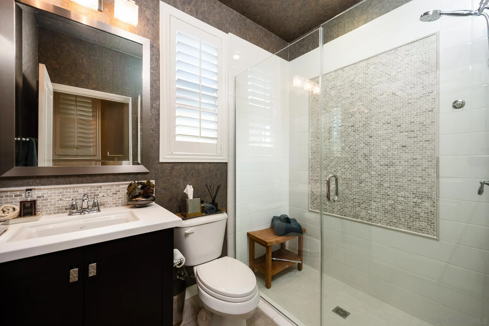 8112 Auberge Circle San Diego, CA 92127 - Photo 17 of 45 a bathroom with a sink vanity mirror and toilet