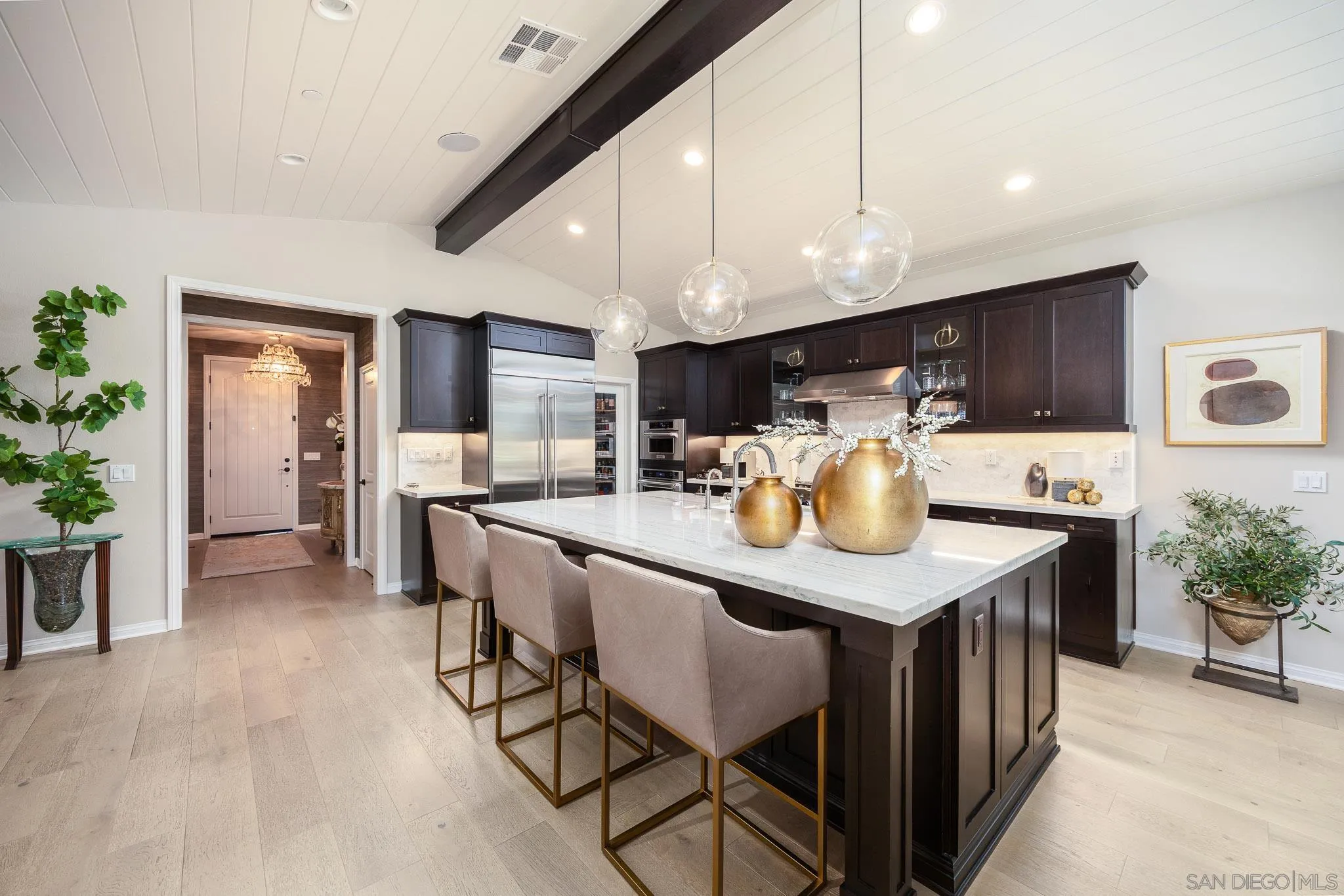 8112 Auberge Circle San Diego, CA 92127 - Photo 2 of 45 a kitchen with stainless steel appliances granite countertop a table chairs sink and cabinets