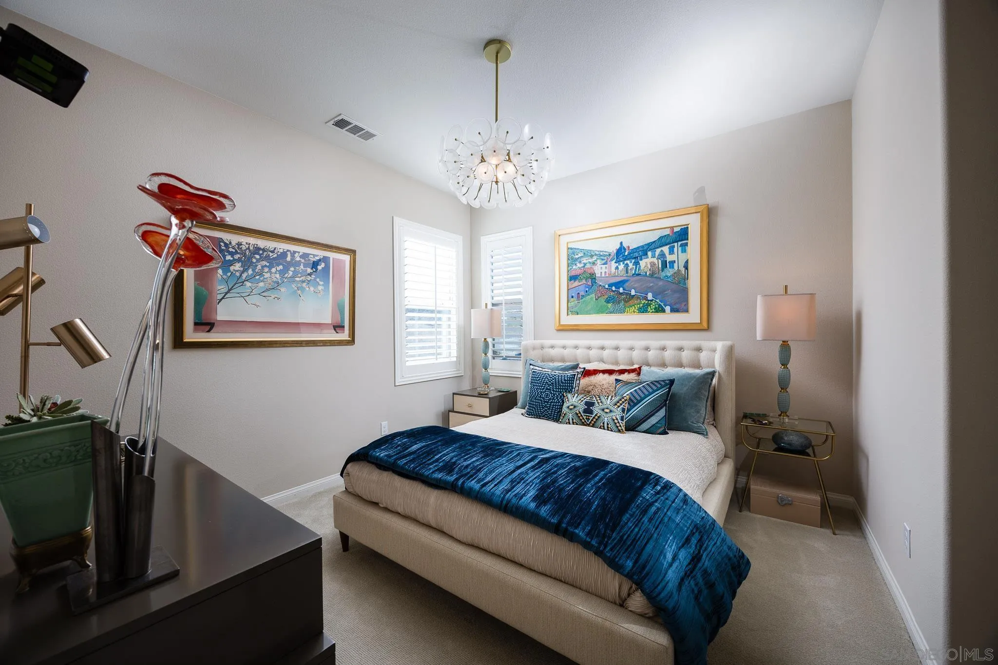 8112 Auberge Circle San Diego, CA 92127 - Photo 21 of 45 a bedroom with a bed and a chandelier
