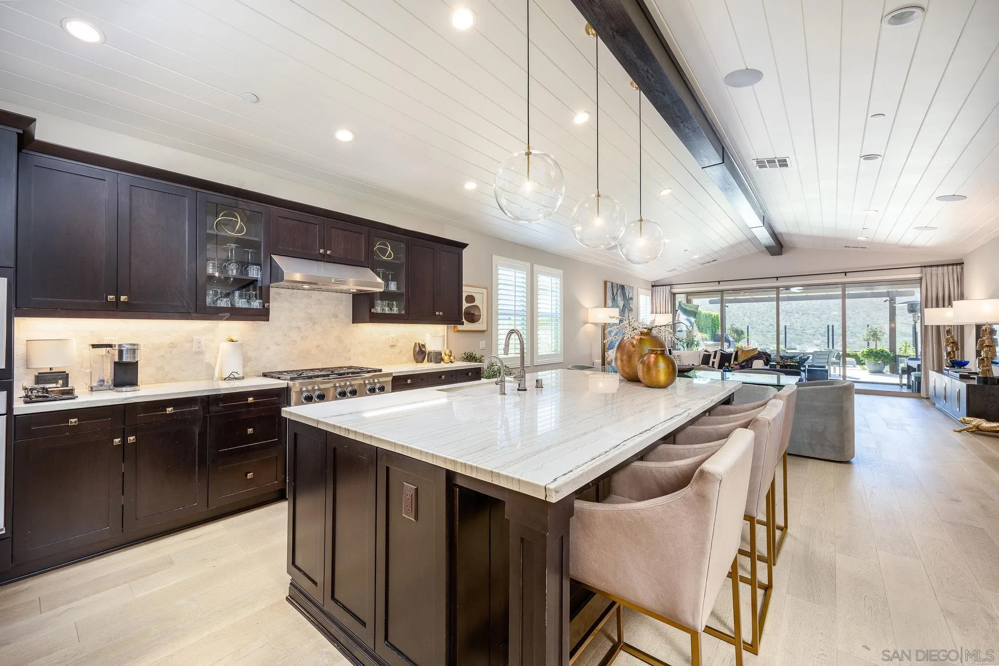 8112 Auberge Circle San Diego, CA 92127 - Photo 3 of 45 a kitchen with a table chairs sink and cabinets