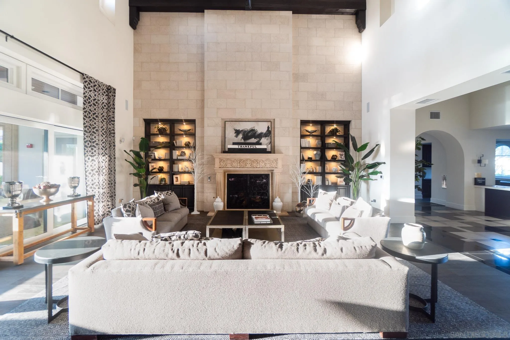 8112 Auberge Circle San Diego, CA 92127 - Photo 33 of 45 a living room with furniture large window and a fireplace