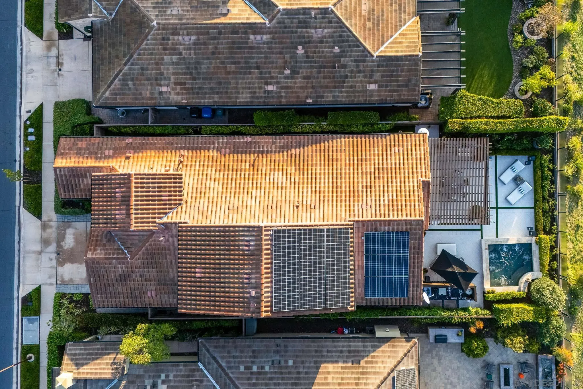 8112 Auberge Circle San Diego, CA 92127 - Photo 44 of 45 a brick building with a small yard and plants
