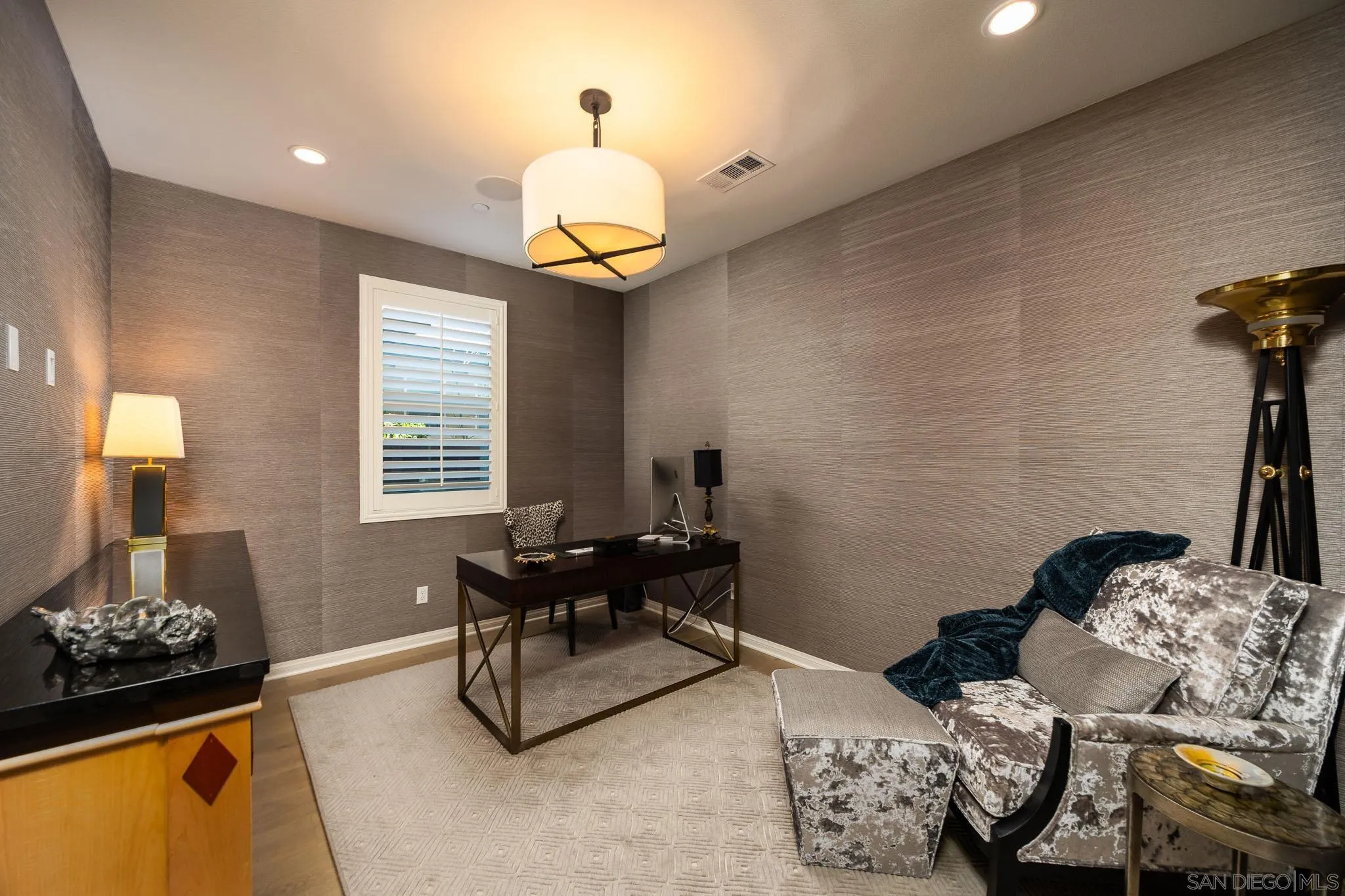 8112 Auberge Circle San Diego, CA 92127 - Photo 8 of 45 a bedroom with bed and a chandelier