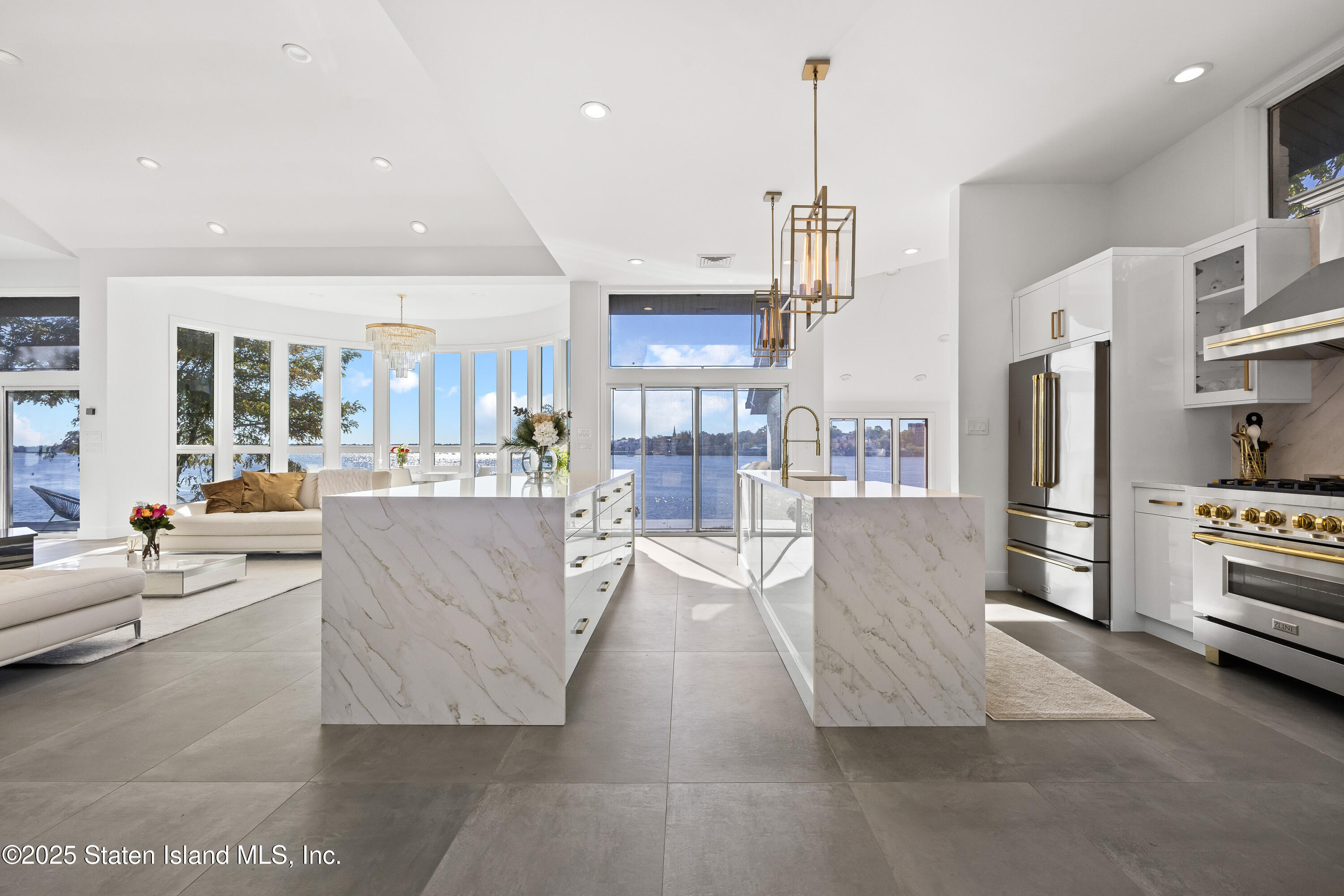 2 Wards Point Avenue Staten Island, NY 10307 - Photo 14 of 38 a living room with stainless steel appliances kitchen island granite countertop furniture a refrigerator a kitchen island a stove and a cabinets