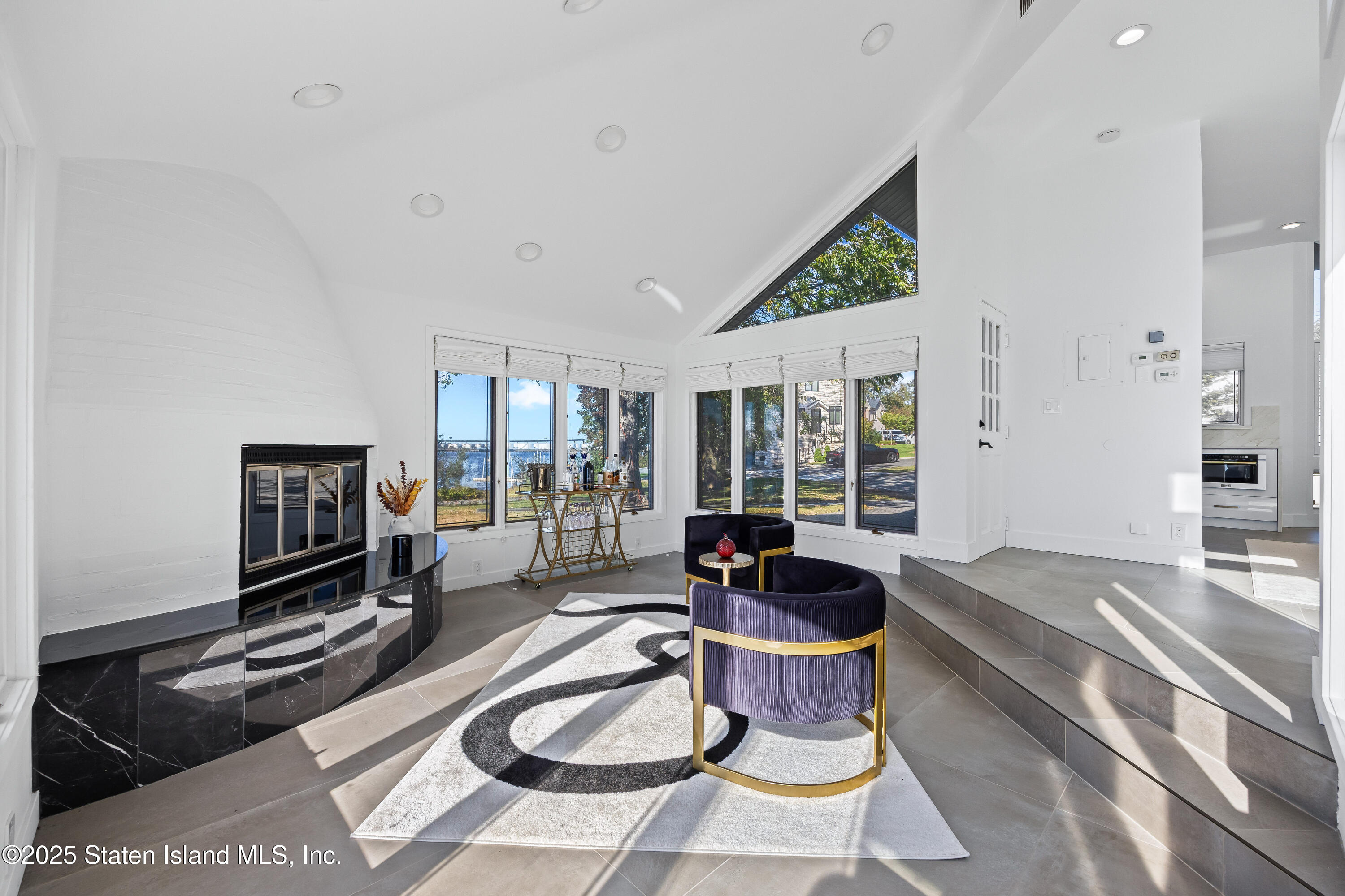 2 Wards Point Avenue Staten Island, NY 10307 - Photo 17 of 38 a living room with furniture a flat screen tv and a large window