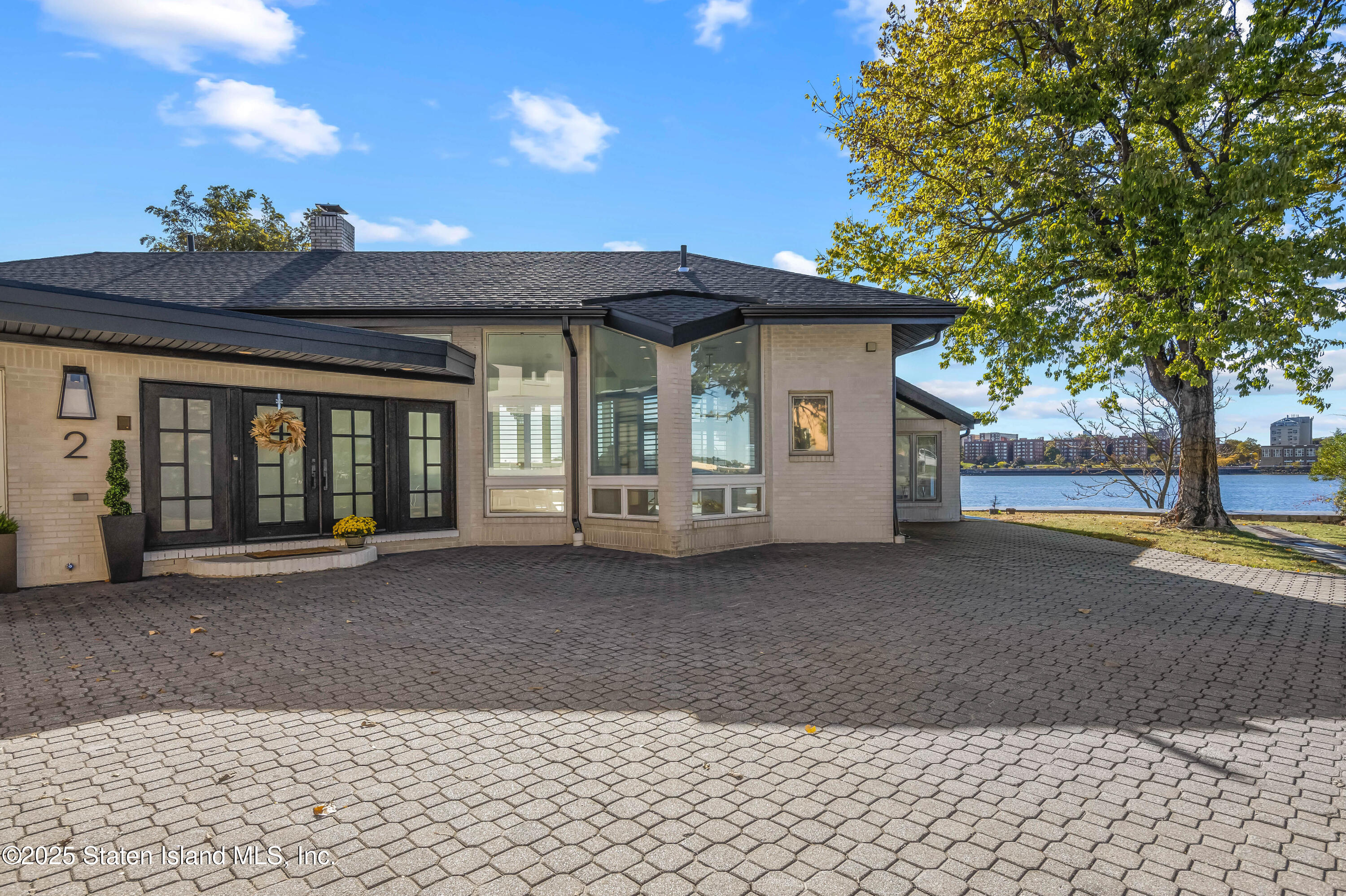 2 Wards Point Avenue Staten Island, NY 10307 - Photo 2 of 38 a view of a house with a yard and garage
