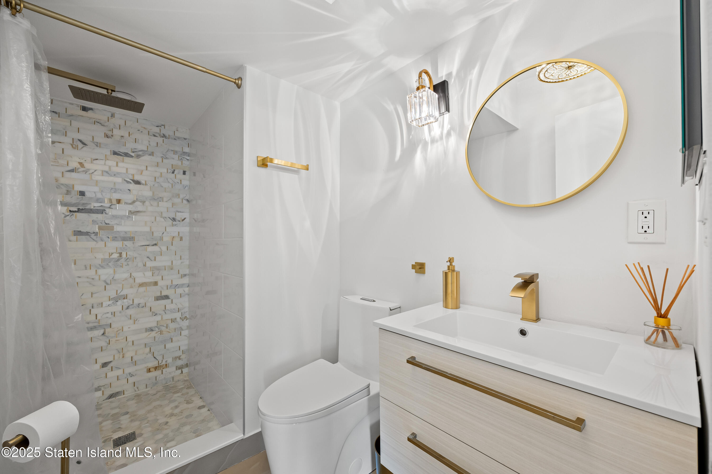 2 Wards Point Avenue Staten Island, NY 10307 - Photo 23 of 38 a bathroom with a sink a toilet and a mirror