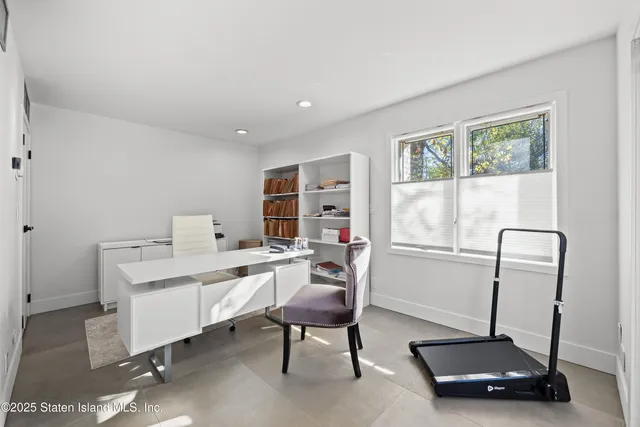 a room with gym equipment and a window