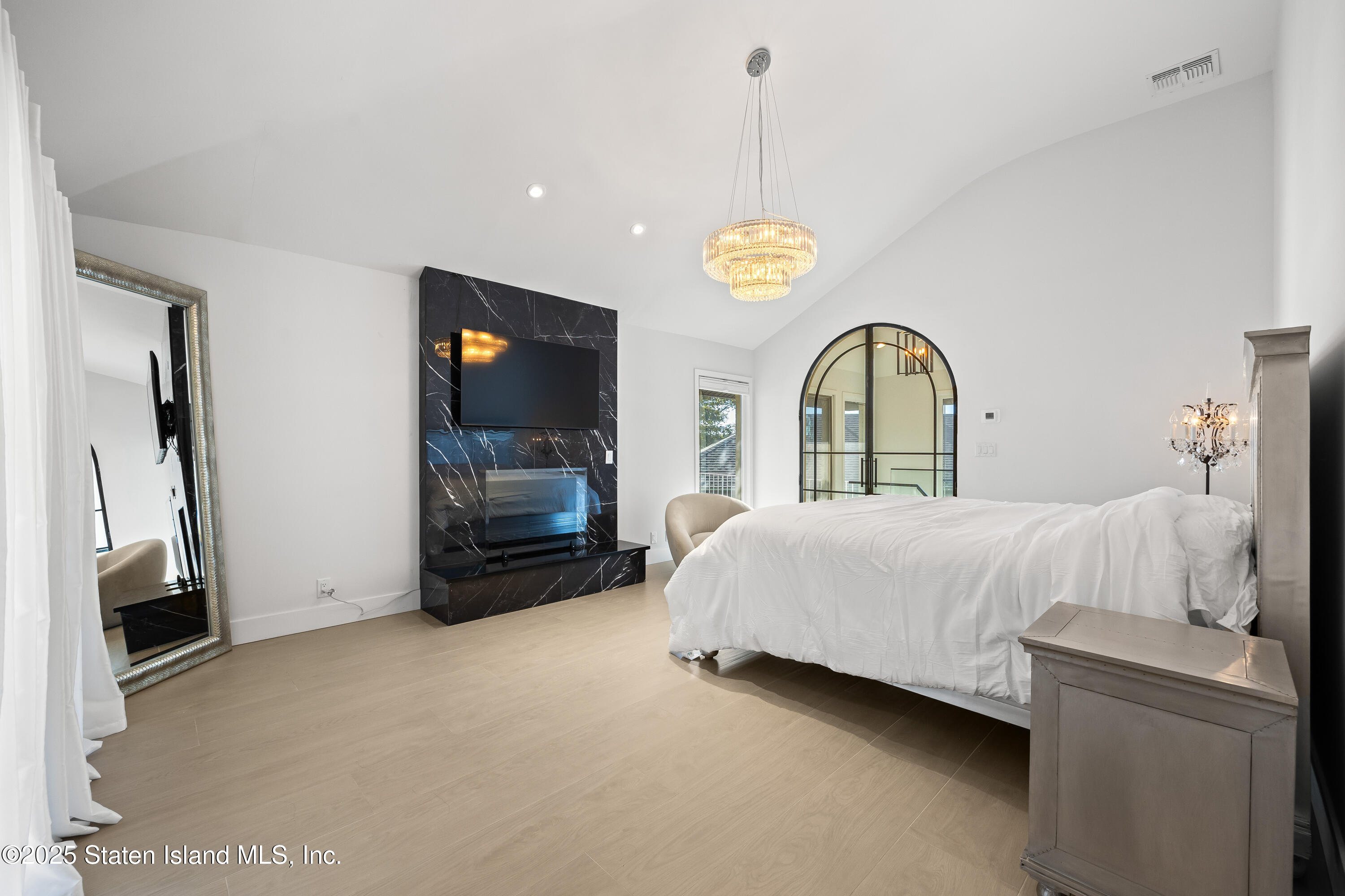 2 Wards Point Avenue Staten Island, NY 10307 - Photo 26 of 38 a spacious bedroom with a bed and a flat screen tv