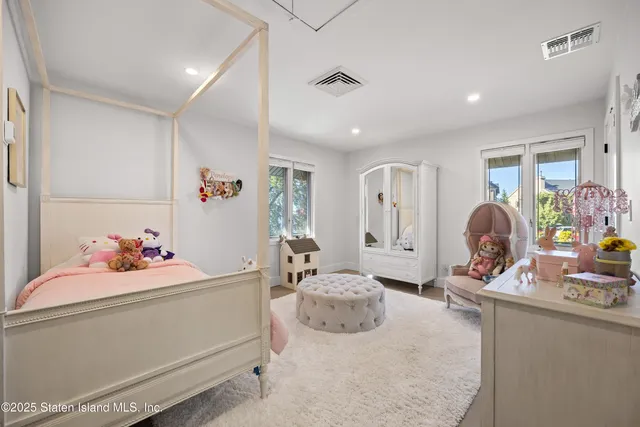 a bedroom with furniture and natural light