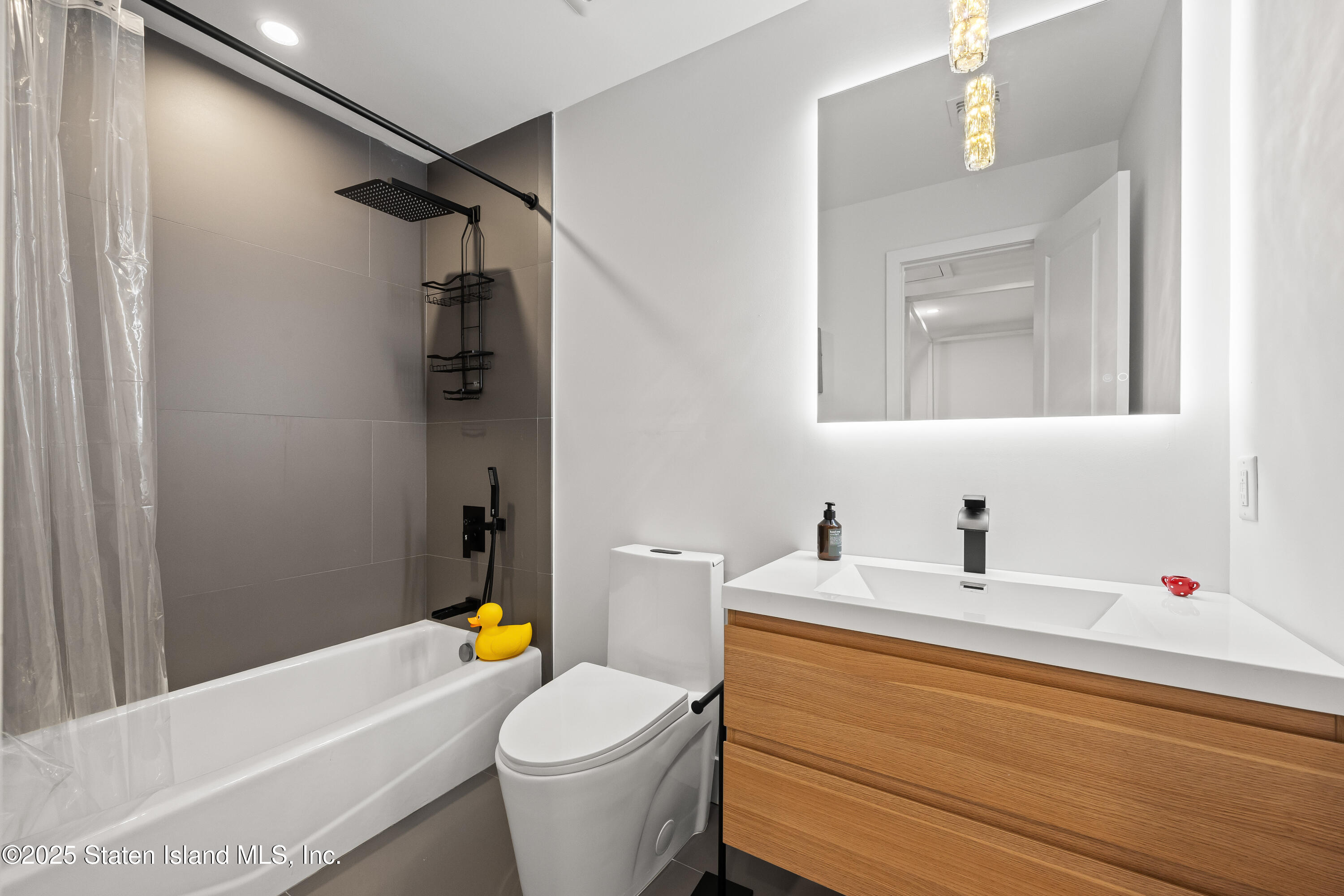 2 Wards Point Avenue Staten Island, NY 10307 - Photo 33 of 38 a bathroom with a sink a toilet and shower