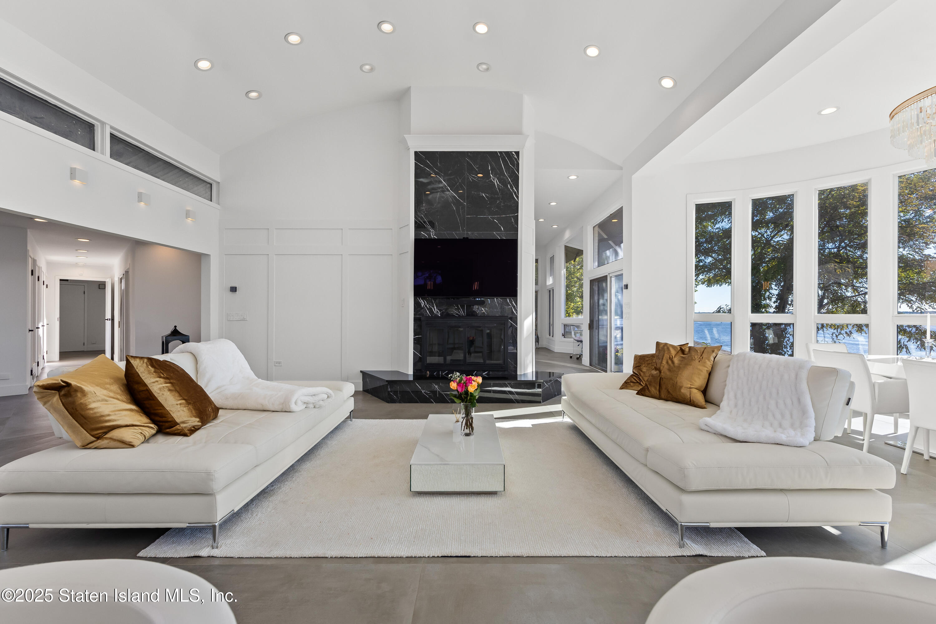 2 Wards Point Avenue Staten Island, NY 10307 - Photo 8 of 38 a living room with furniture and a fireplace