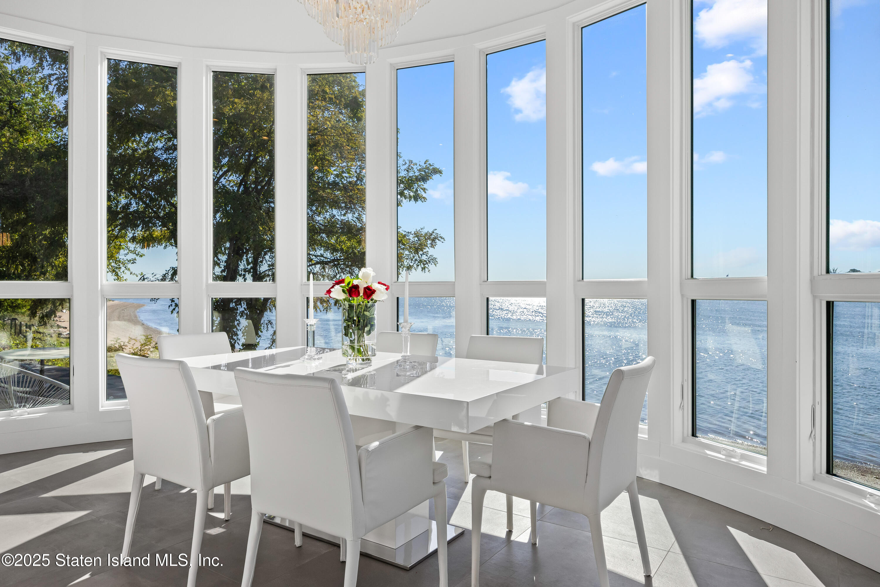 2 Wards Point Avenue Staten Island, NY 10307 - Photo 10 of 38 a dining room with furniture a chandelier and wooden floor