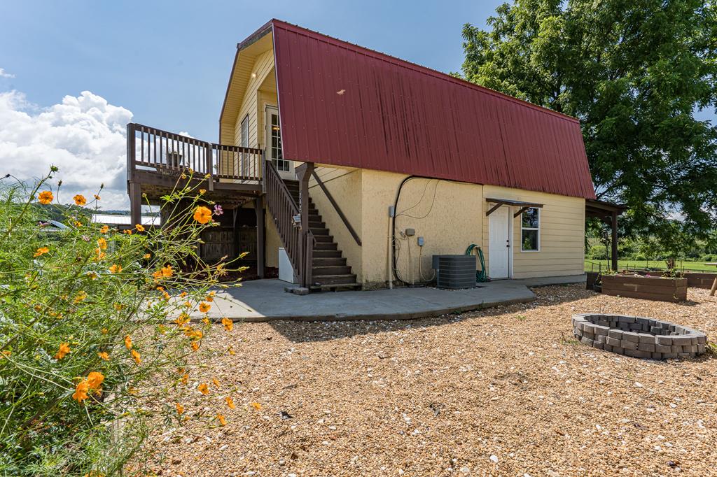 a view of a house with wooden fence