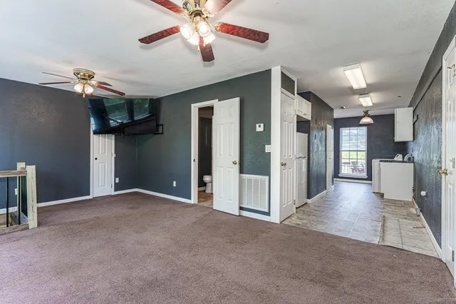 a kitchen with a refrigerator a sink and cabinets