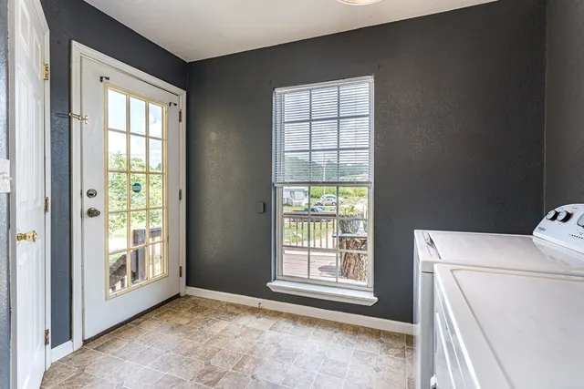 an aerial view of houses covered in trees