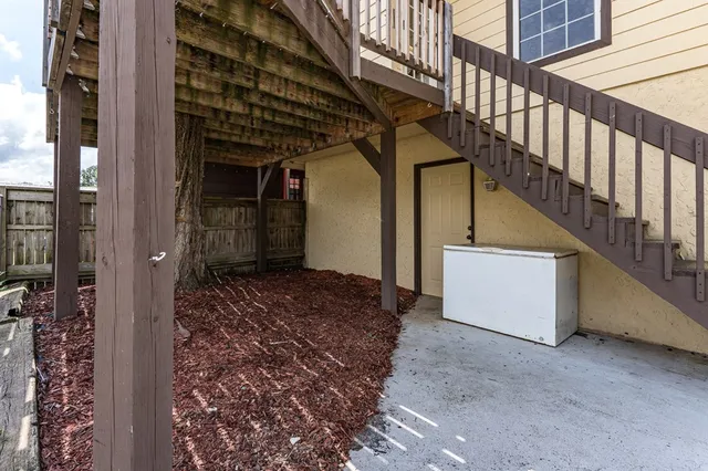 a view of a backyard with sitting area