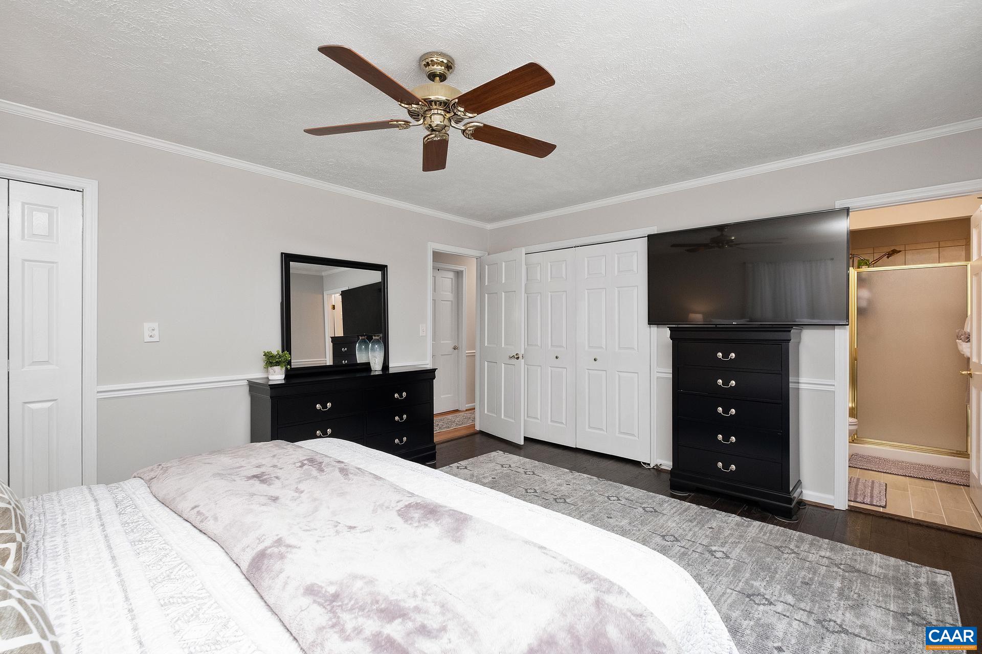 2714 Huntington Road Charlottesville, VA 22901 - Photo 13 of 50 a bedroom with a bed and a mirror on the dresser