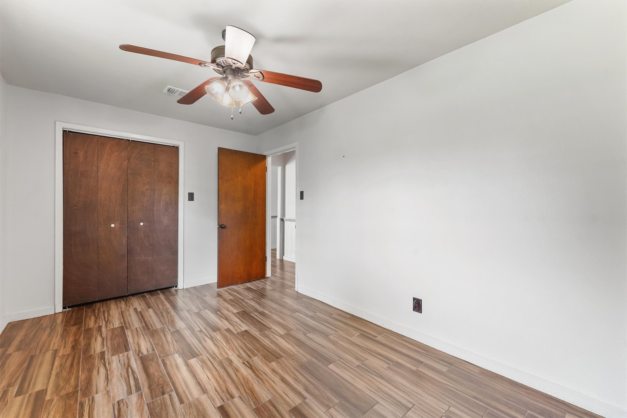 326 Broad Ripple Drive Houston, TX 77336 - Photo 16 of 26 a view of empty room with wooden floor