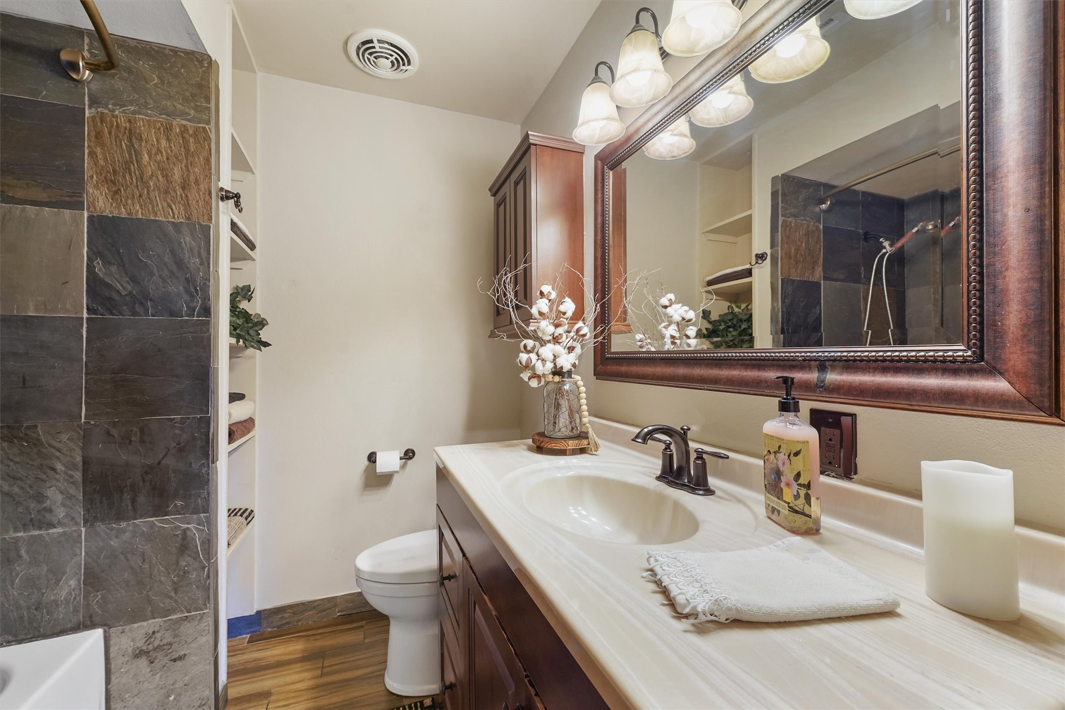 326 Broad Ripple Drive Houston, TX 77336 - Photo 17 of 26 a bathroom with a granite countertop sink a toilet and a mirror