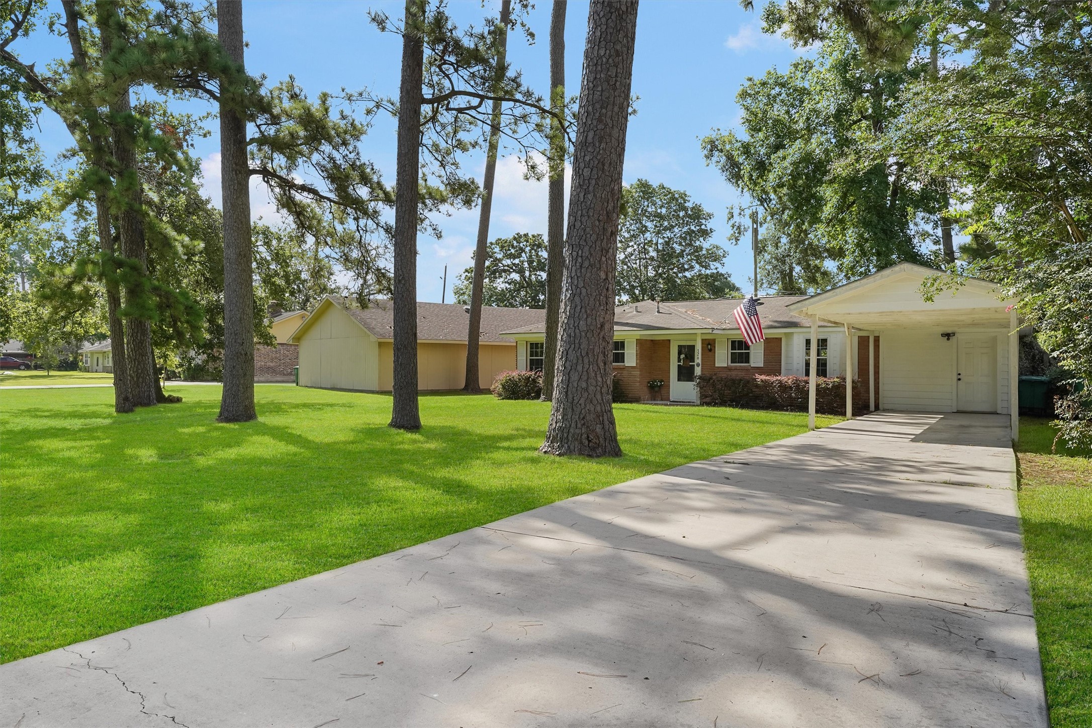 326 Broad Ripple Drive Houston, TX 77336 - Photo 2 of 26 a view of house with a garden