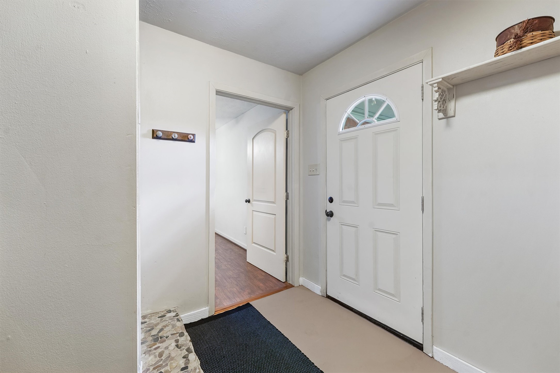326 Broad Ripple Drive Houston, TX 77336 - Photo 22 of 26 a view of a hallway with wooden floor