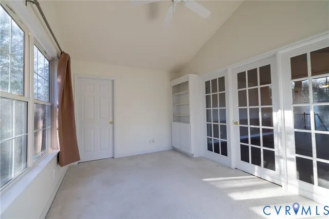 a view of empty room with windows