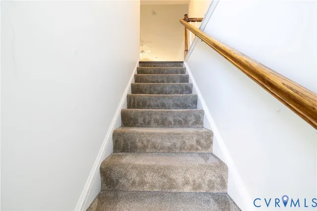 a view of staircase with white walls