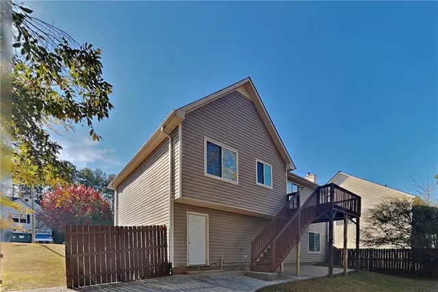 a picture of a bench in front of a wall