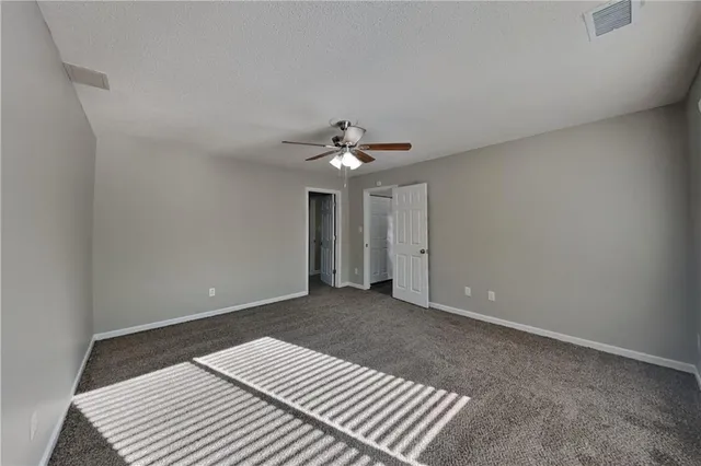 a view of wooden floor and chandelier in a room
