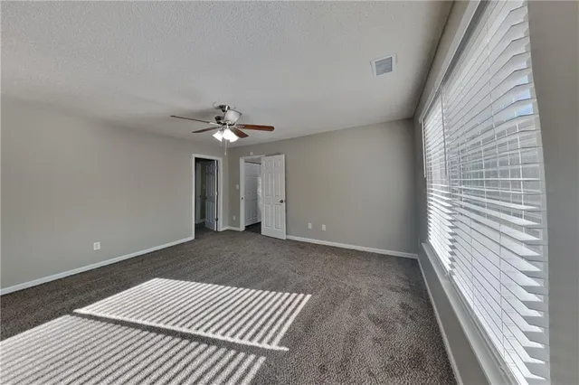 a view of a livingroom with a ceiling fan