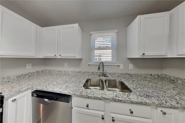a kitchen with appliances cabinets and a counter top