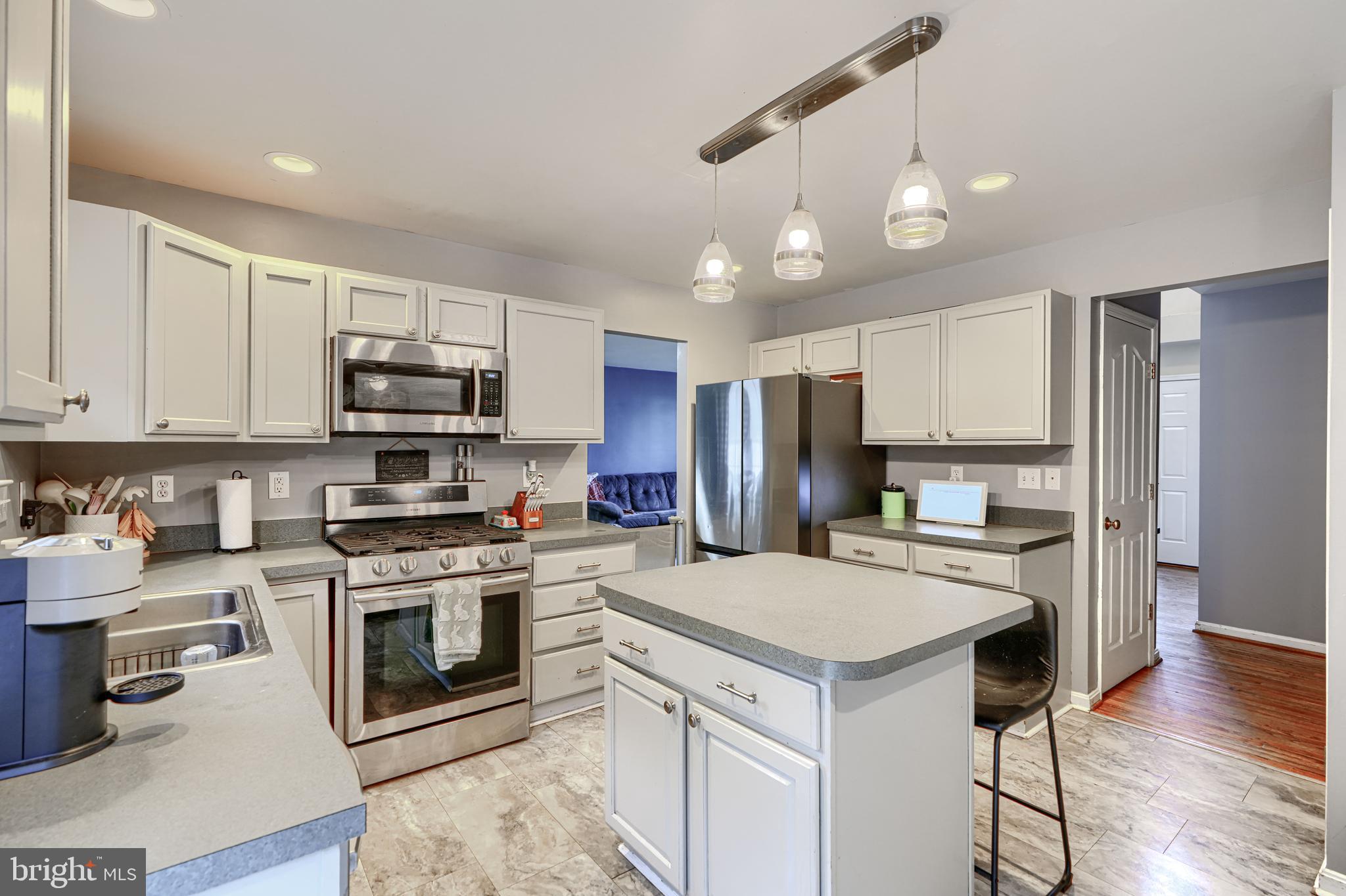 24 Ches Haven Road Earleville, MD 21919 - Photo 23 of 73 a kitchen with a stove a sink and a refrigerator