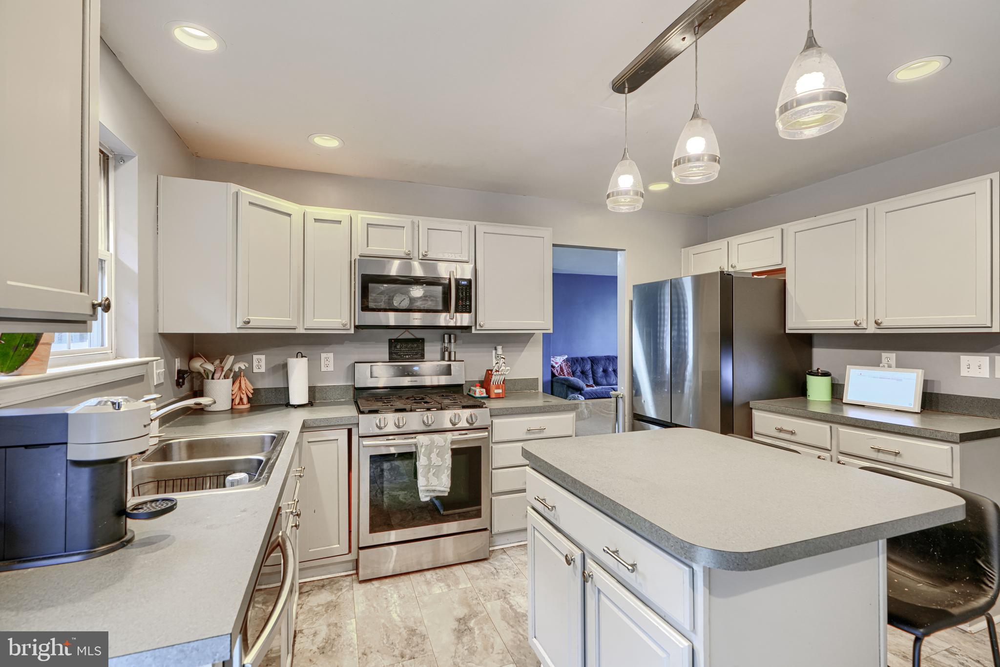 24 Ches Haven Road Earleville, MD 21919 - Photo 24 of 73 a kitchen with a stove a sink and a refrigerator