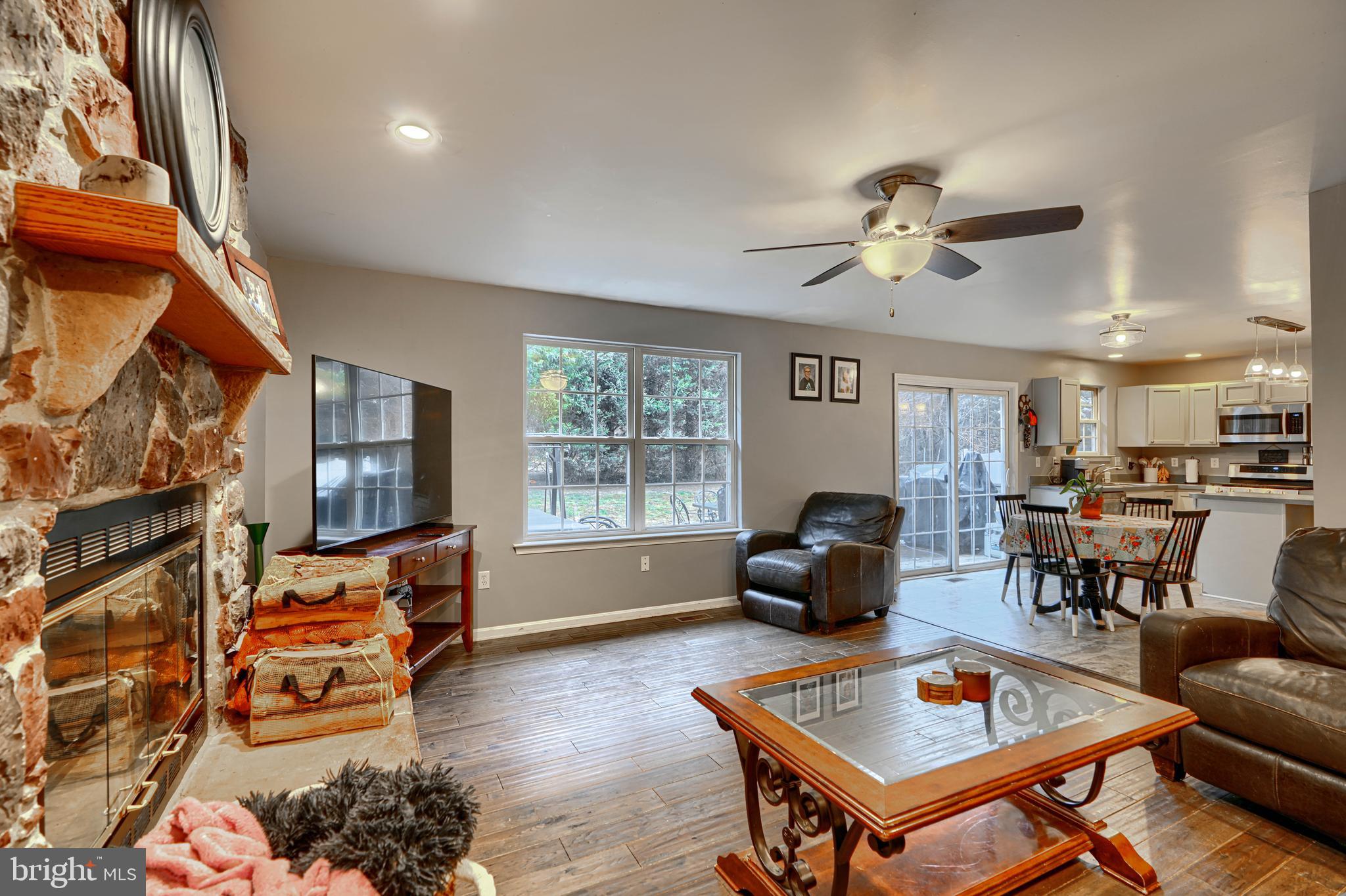 24 Ches Haven Road Earleville, MD 21919 - Photo 28 of 73 a living room with furniture a rug and a chandelier