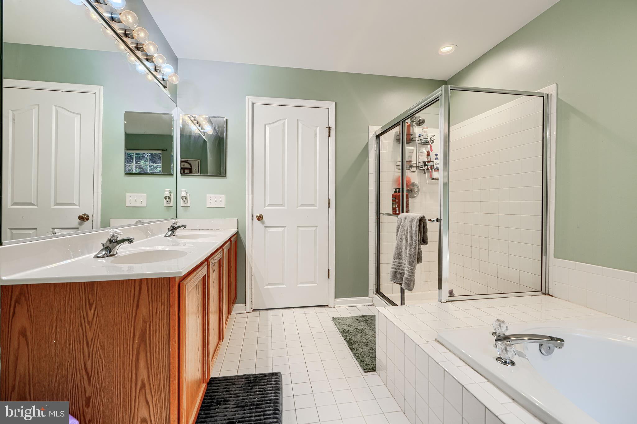 24 Ches Haven Road Earleville, MD 21919 - Photo 38 of 73 a bathroom with a tub sink and mirror