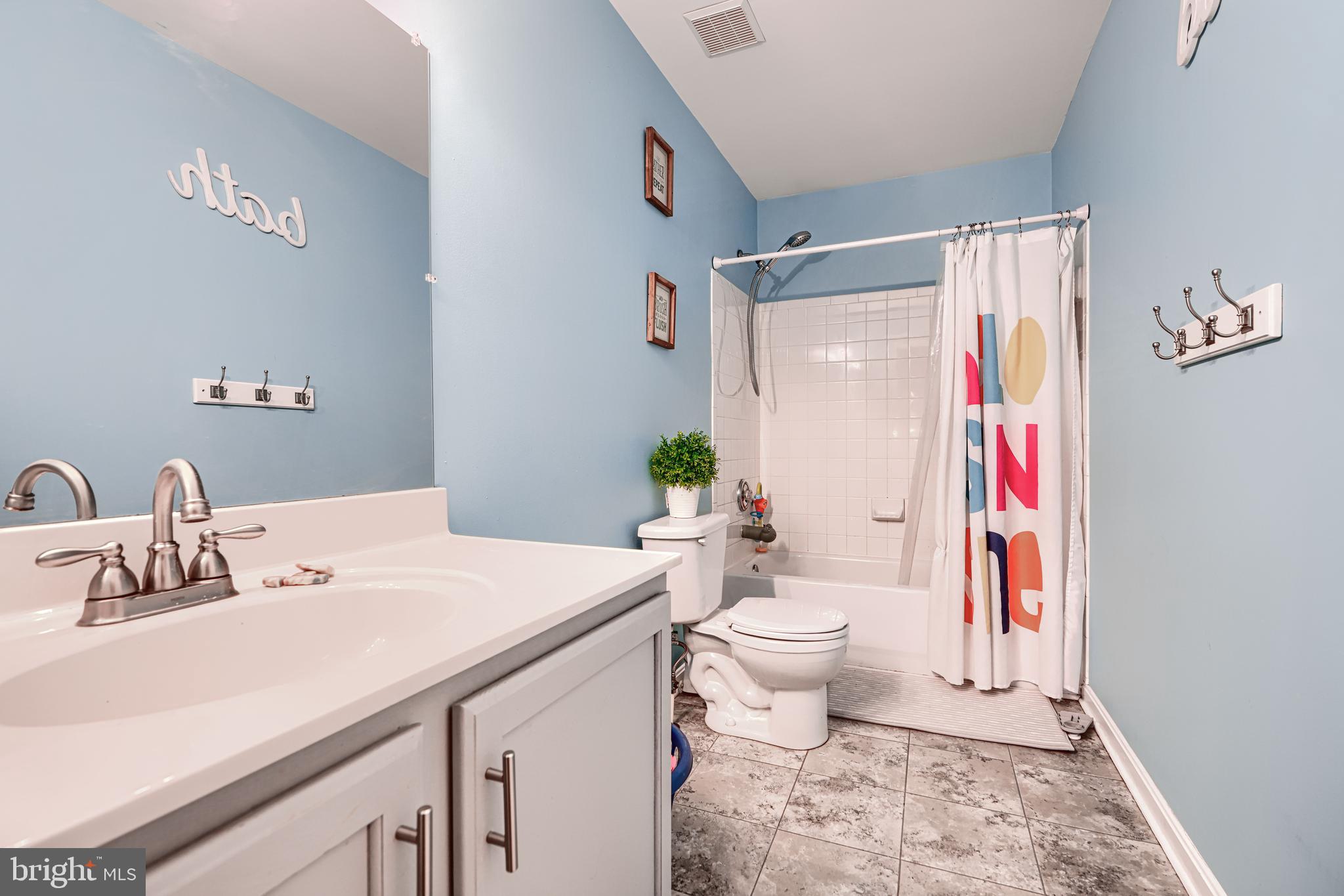 24 Ches Haven Road Earleville, MD 21919 - Photo 48 of 73 a bathroom with a sink a toilet and a shower
