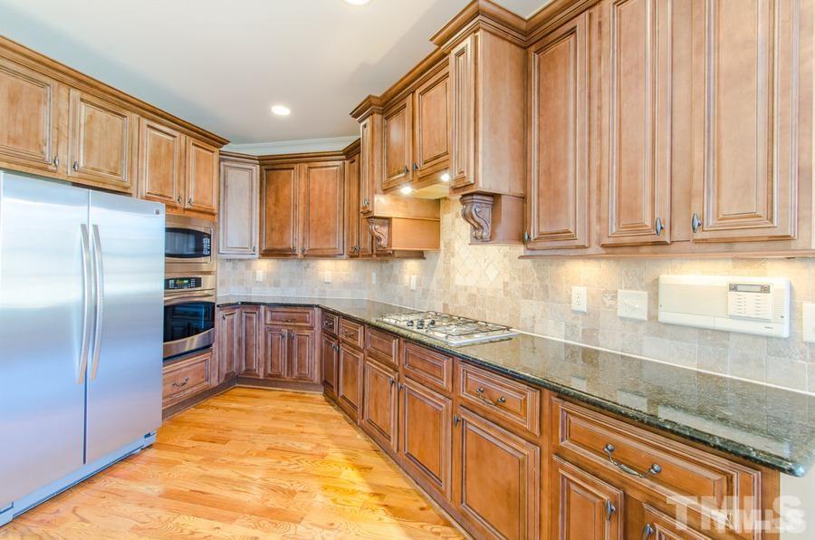 305 Woodlief Farm Road Rolesville, NC 27571 - Photo 9 of 25 Granite, tons of cabinets, loads of counter space