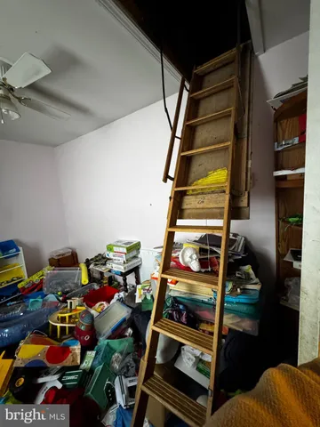 a kitchen with a stove top oven and cabinets