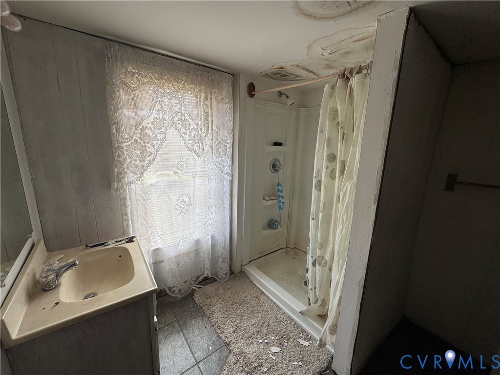 303 Purdy Road Emporia, VA 23847 - Photo 8 of 18 a bathroom with a sink toilet and shower