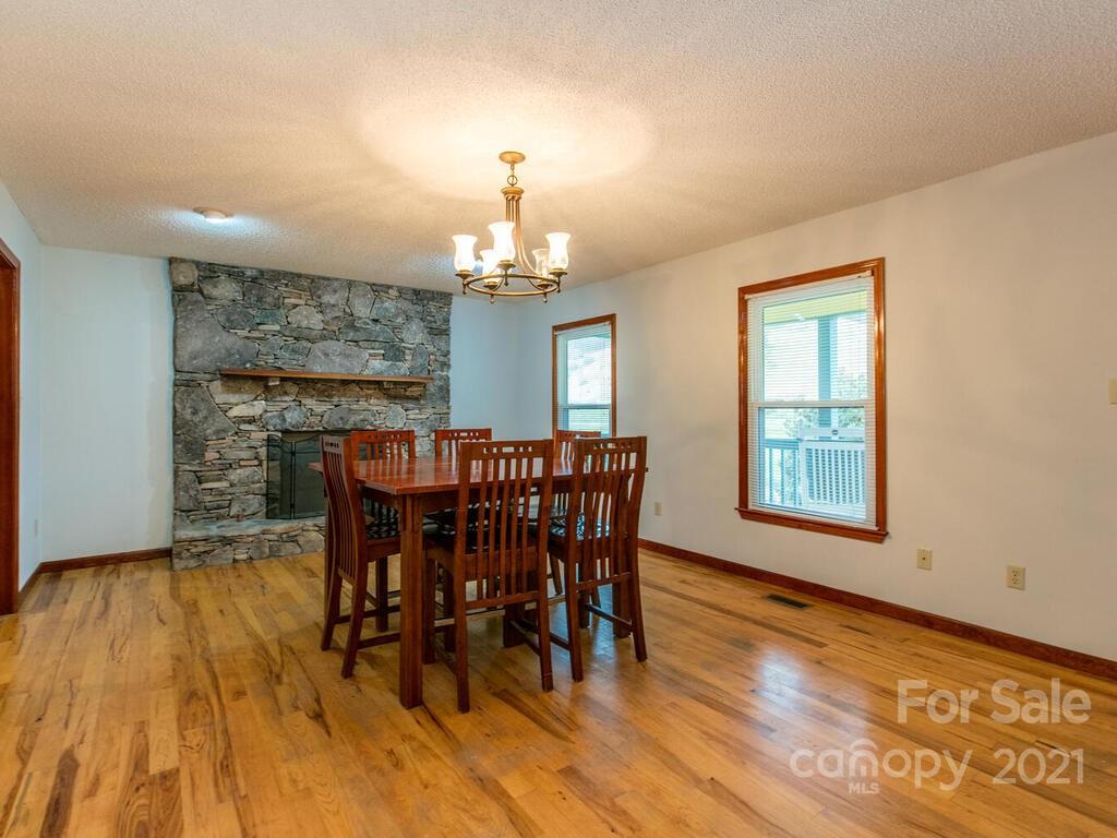 20 Brooks Branch Road Leicester, NC 28748 - Photo 15 of 40 a view of a dining room with furniture window and wooden floor