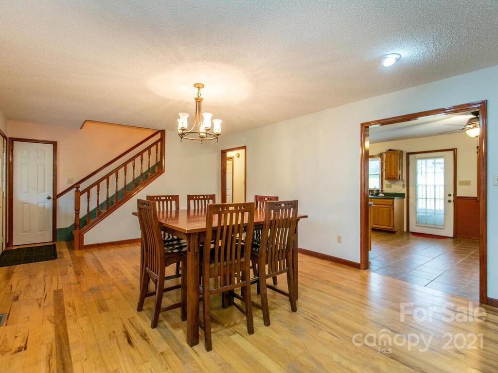 20 Brooks Branch Road Leicester, NC 28748 - Photo 16 of 40 a view of a dining room with furniture and wooden floor