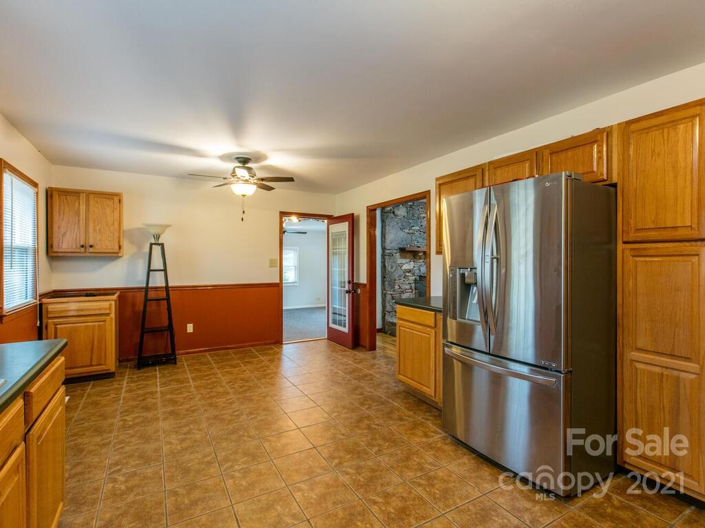 20 Brooks Branch Road Leicester, NC 28748 - Photo 19 of 40 a kitchen with stainless steel appliances a refrigerator and a stove