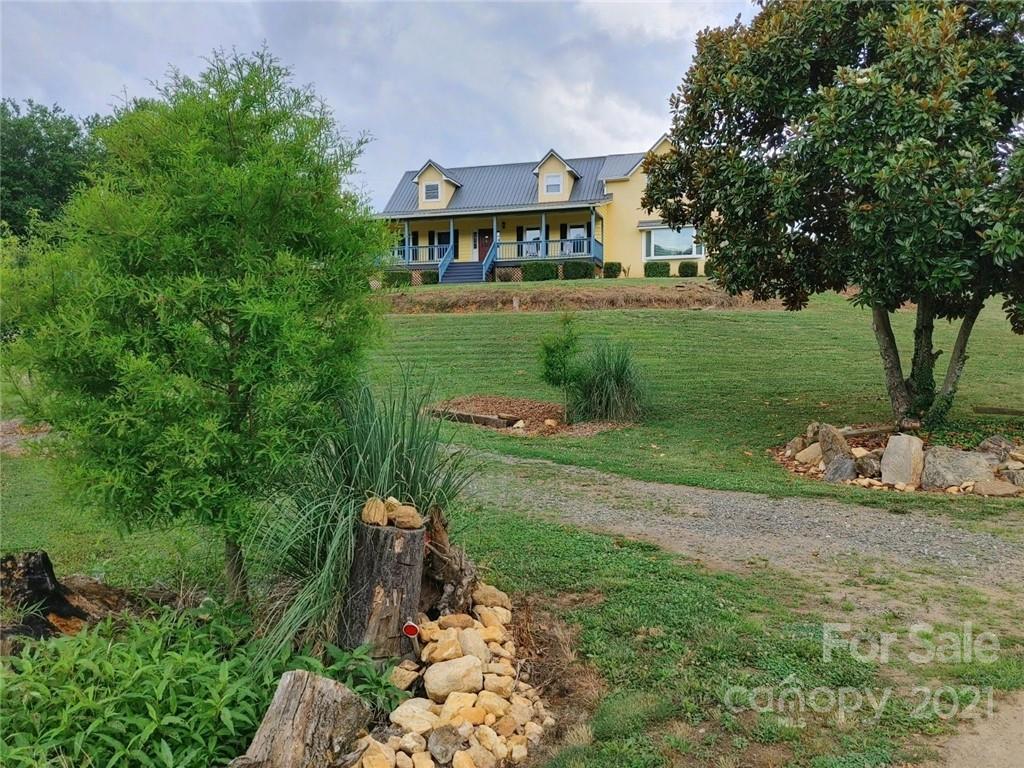 20 Brooks Branch Road Leicester, NC 28748 - Photo 3 of 40 a view of a garden with a building in the background