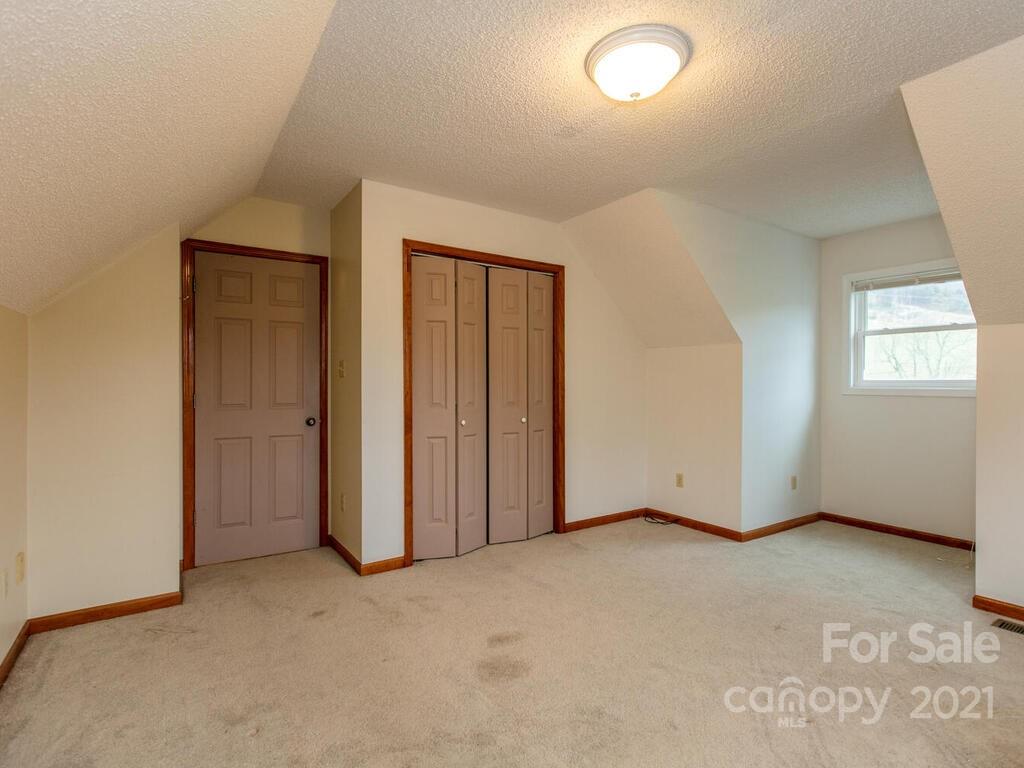 20 Brooks Branch Road Leicester, NC 28748 - Photo 27 of 40 an empty room with windows and closet