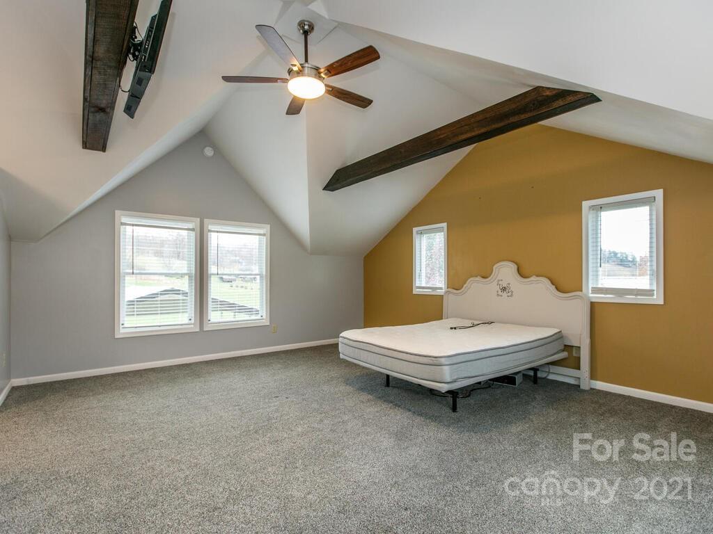 20 Brooks Branch Road Leicester, NC 28748 - Photo 29 of 40 a living room with a bed furniture and a window