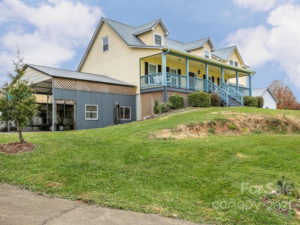 20 Brooks Branch Road Leicester, NC 28748 - Photo 5 of 40 a view of a big house with a big yard and large tree