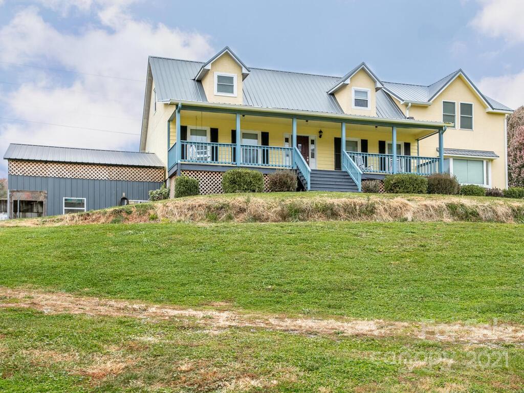 20 Brooks Branch Road Leicester, NC 28748 - Photo 6 of 40 a front view of a house with a garden